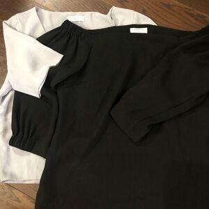 1 black off the shoulder top and a long sleeve top Babaton
